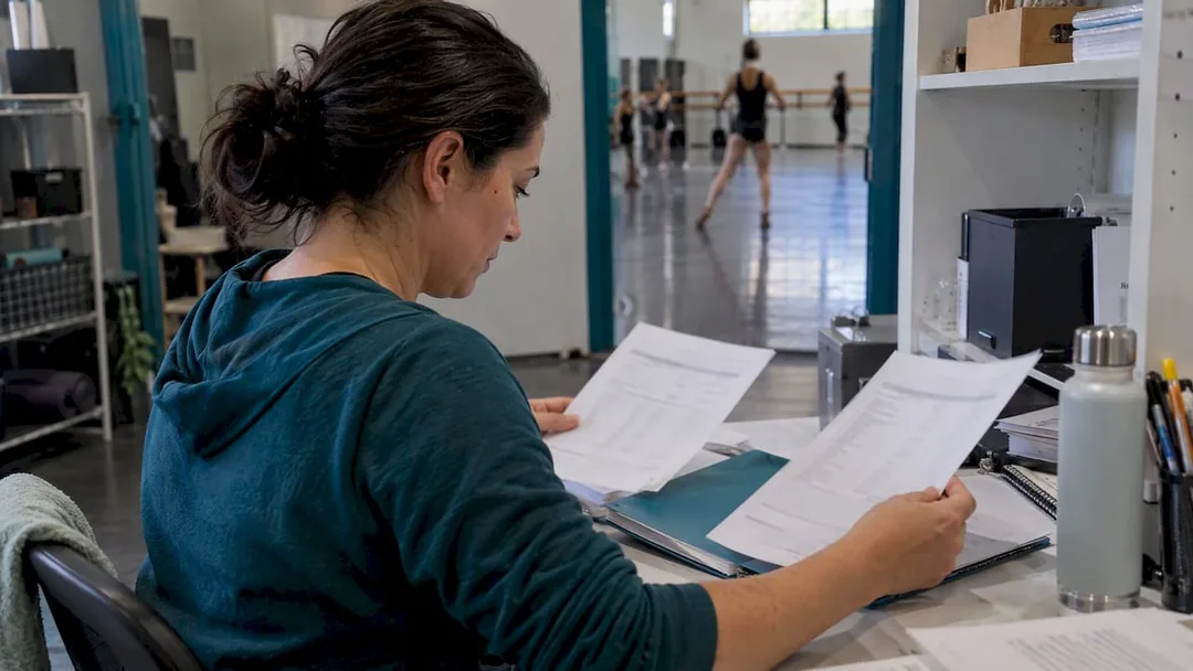 Studio owner reviewing GST turnover paperwork